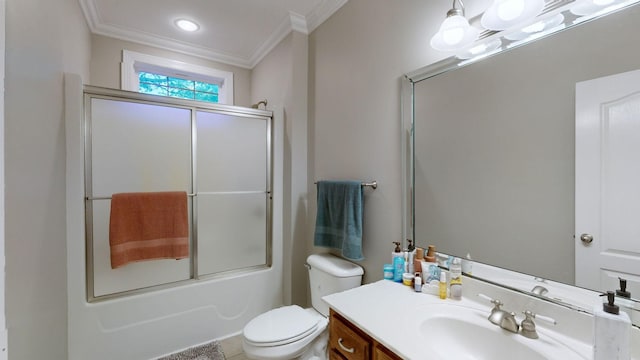 full bathroom with tile patterned floors, vanity, crown molding, enclosed tub / shower combo, and toilet