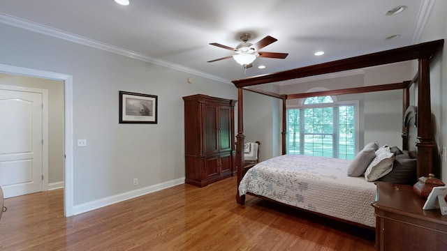 bedroom featuring ceiling fan, crown molding, and light hardwood / wood-style floors