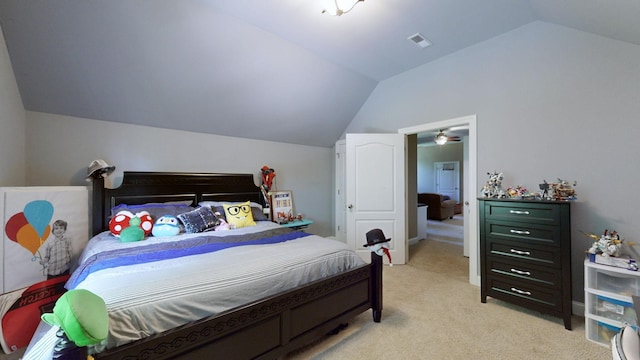 carpeted bedroom with lofted ceiling