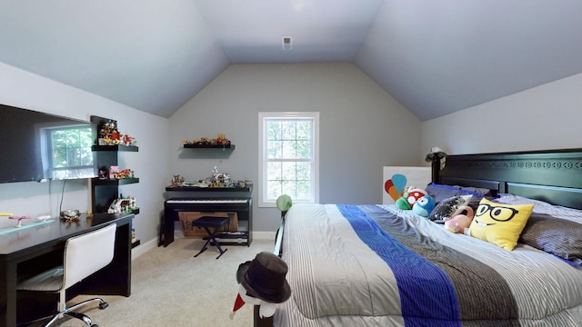 carpeted bedroom with vaulted ceiling