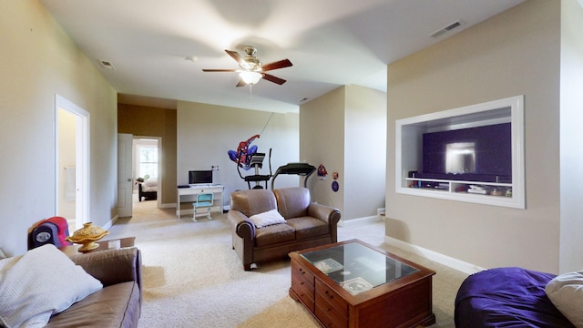 living room featuring light carpet and ceiling fan