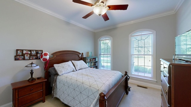 bedroom with ceiling fan, crown molding, and light carpet