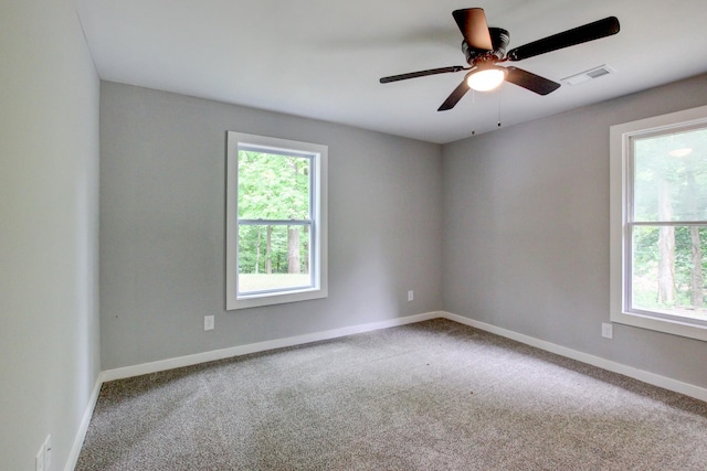 carpeted empty room featuring ceiling fan