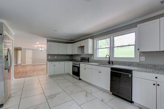 kitchen featuring light stone countertops, sink, white cabinets, and stainless steel appliances