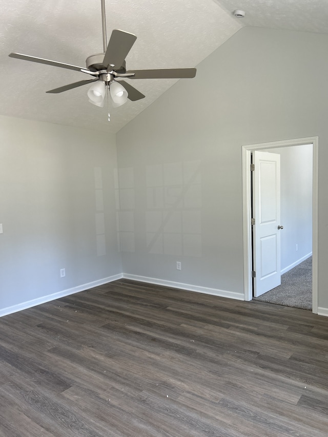 spare room featuring a textured ceiling, dark hardwood / wood-style flooring, ceiling fan, and lofted ceiling