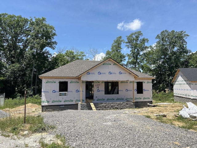 property in mid-construction with covered porch