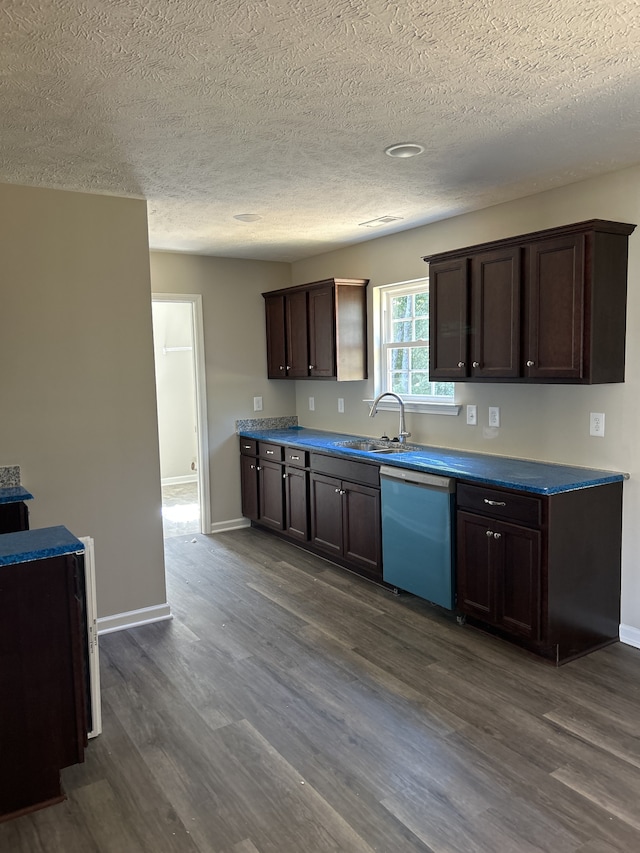 kitchen with sink, dark wood-type flooring, dark brown cabinets, and dishwasher