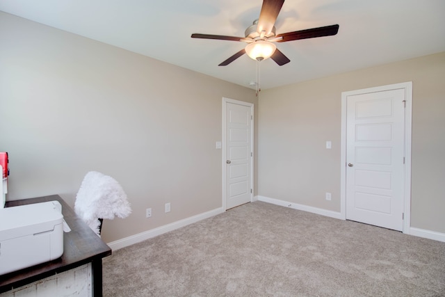 unfurnished office with light carpet and ceiling fan