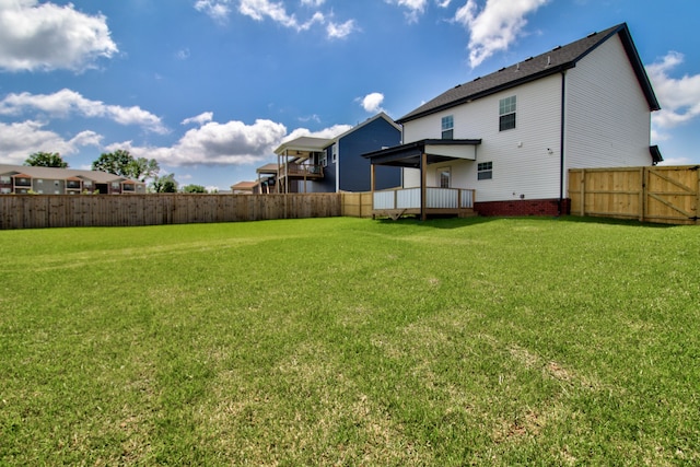 view of yard with a deck