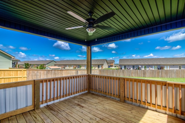 wooden deck featuring ceiling fan