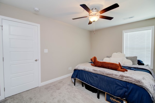 carpeted bedroom with ceiling fan