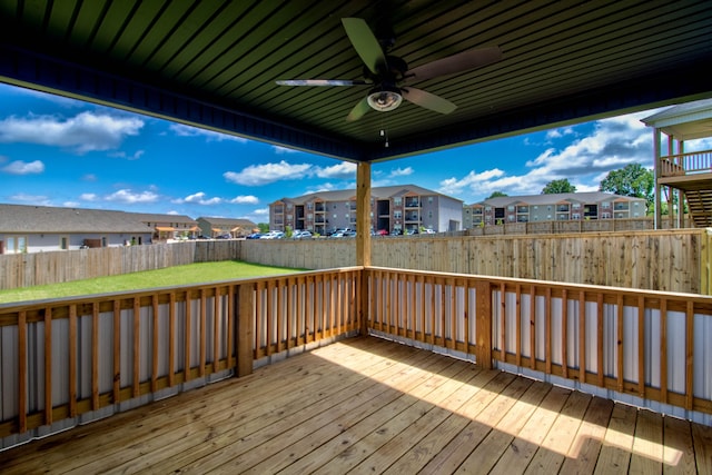 wooden terrace featuring ceiling fan