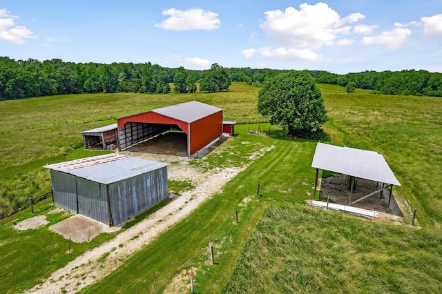 bird's eye view featuring a rural view and a wooded view