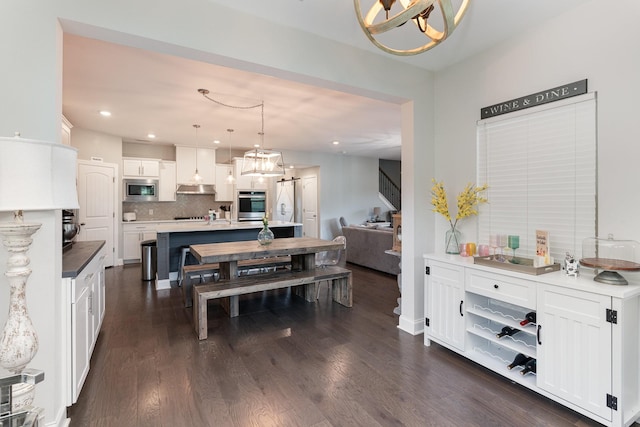 dining room with dark hardwood / wood-style floors