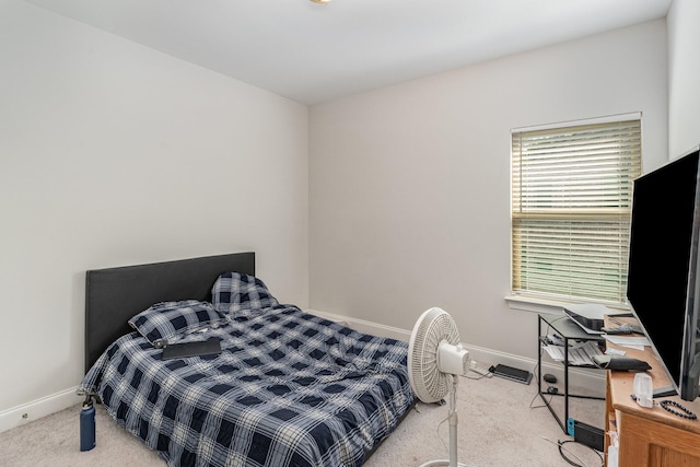 bedroom with light colored carpet