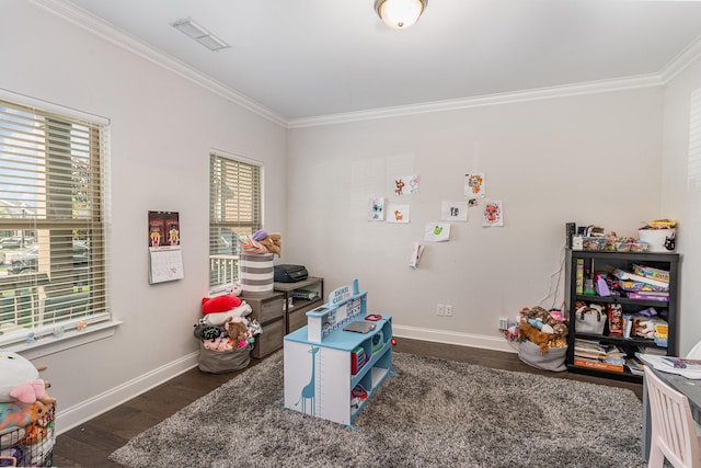 game room with dark hardwood / wood-style flooring and ornamental molding