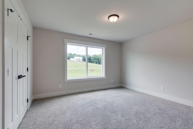 view of carpeted spare room