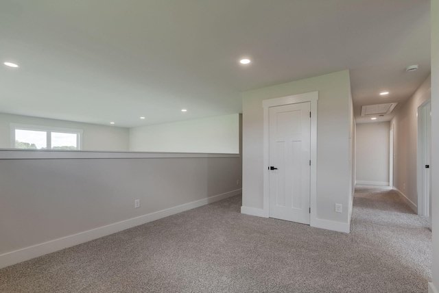 basement featuring light colored carpet