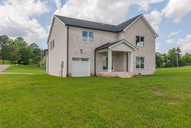 view of front facade featuring a front yard and a garage