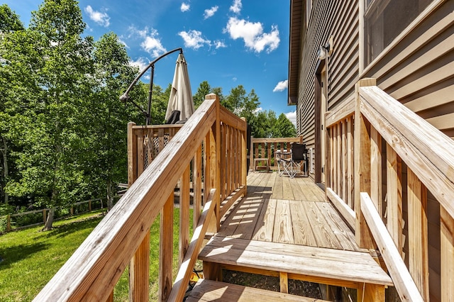 deck with outdoor dining space and fence