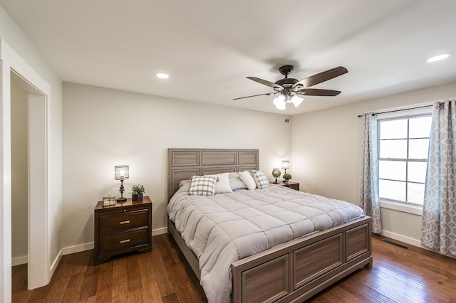 bedroom featuring dark wood-type flooring, recessed lighting, visible vents, and baseboards