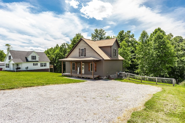 view of front of house featuring a front yard and a porch