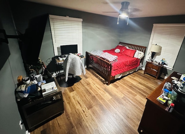 bedroom featuring hardwood / wood-style flooring and ceiling fan