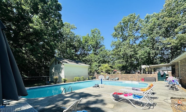 view of pool featuring a patio