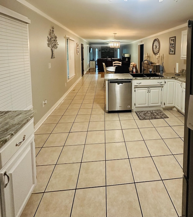 kitchen with stainless steel dishwasher, white cabinets, light tile patterned floors, and crown molding