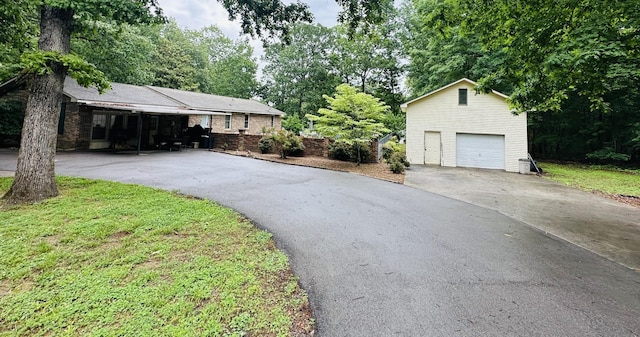 exterior space featuring an outbuilding and a garage