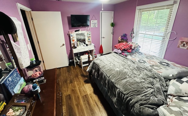 bedroom featuring dark hardwood / wood-style flooring