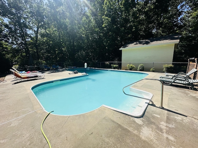 view of swimming pool with a patio area