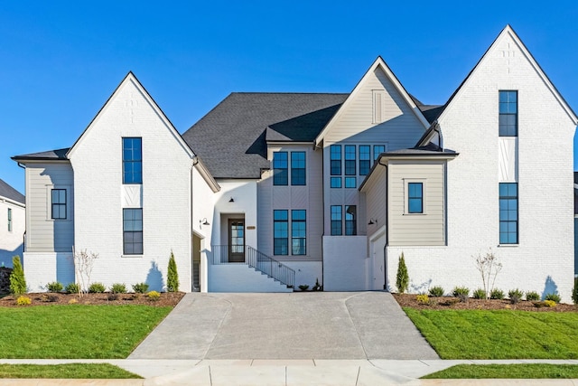 view of front of property with a front lawn