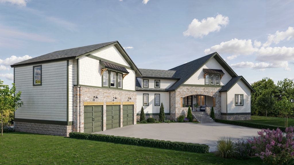 view of front of house with a garage and a front lawn