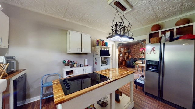 kitchen featuring wooden counters, stainless steel refrigerator with ice dispenser, dark hardwood / wood-style flooring, white cabinets, and hanging light fixtures