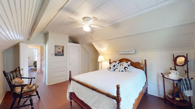 bedroom featuring hardwood / wood-style flooring, ceiling fan, and lofted ceiling