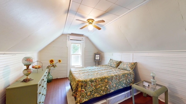 bedroom with hardwood / wood-style flooring, a wall unit AC, ceiling fan, and lofted ceiling