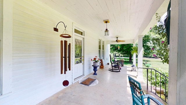 view of patio with ceiling fan and a porch