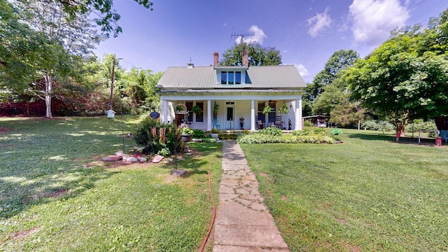 view of front of property with a porch and a front lawn