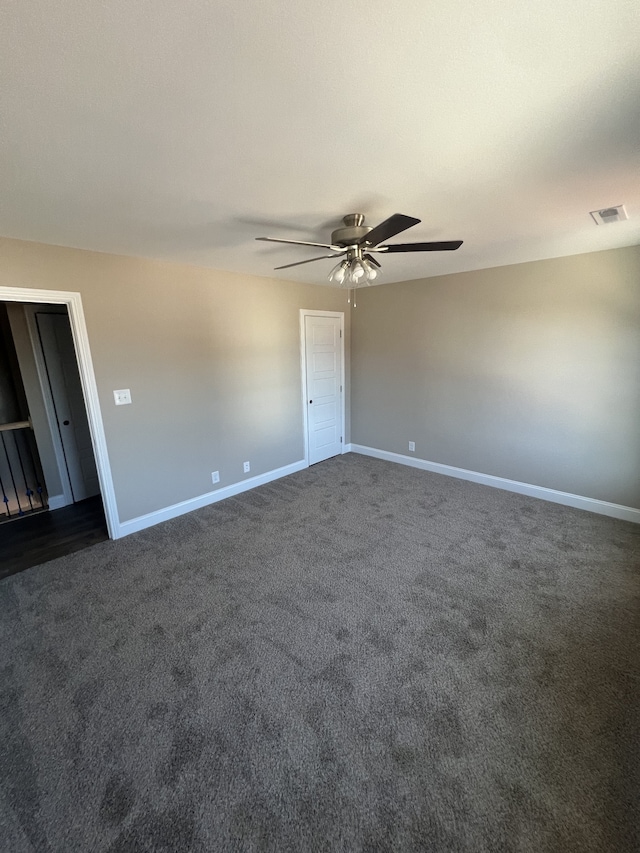 carpeted empty room with ceiling fan