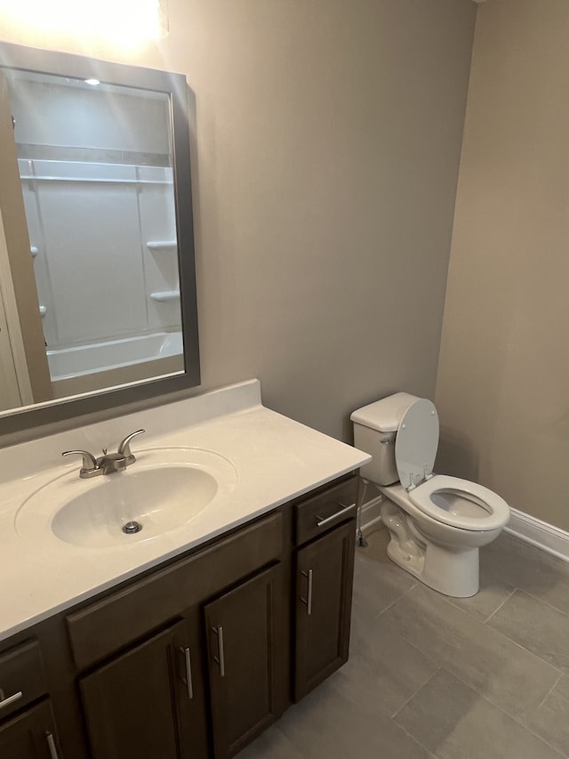 bathroom with tile patterned floors, vanity, and toilet