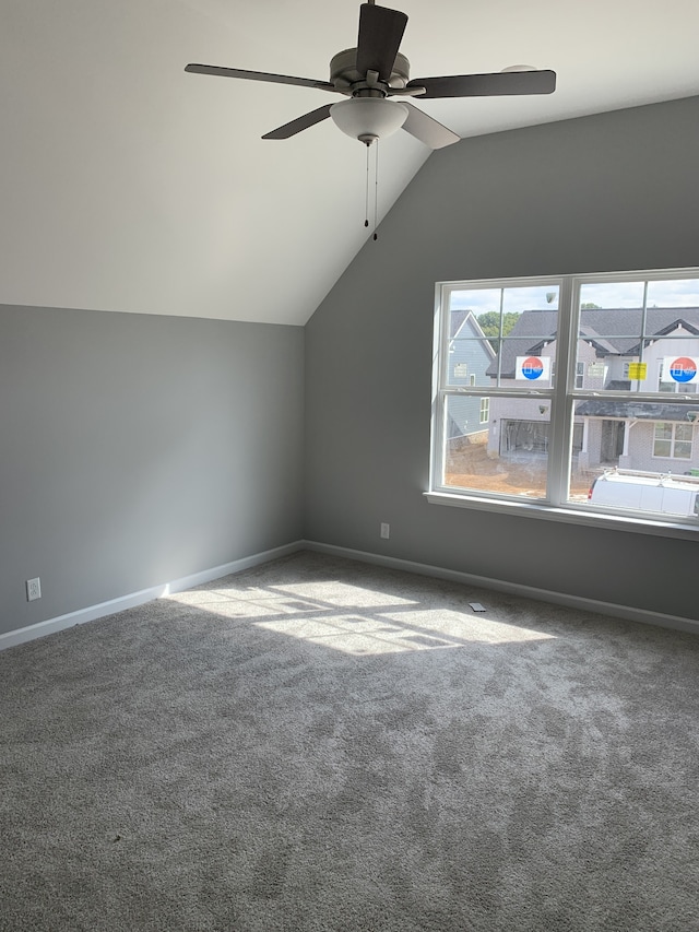 bonus room with vaulted ceiling, ceiling fan, and carpet