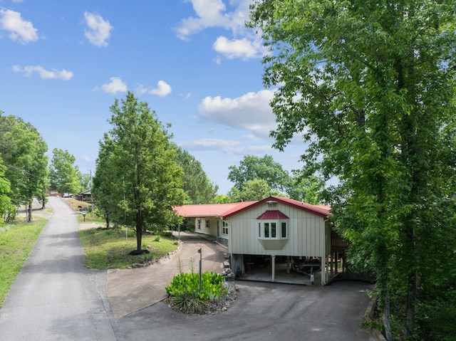 view of front of home with a carport