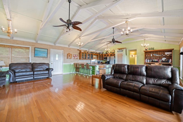 living room with light wood-type flooring, lofted ceiling with beams, and ceiling fan