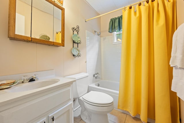 full bathroom featuring tile patterned flooring, vanity, toilet, and shower / bath combo with shower curtain