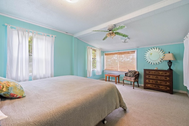 bedroom with a textured ceiling, ceiling fan, carpet, and vaulted ceiling