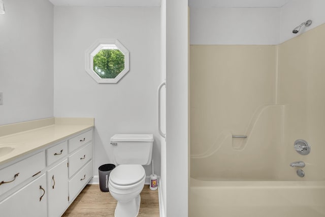 full bathroom featuring vanity, toilet, shower / bath combination, and wood-type flooring