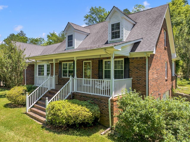 cape cod home with a porch