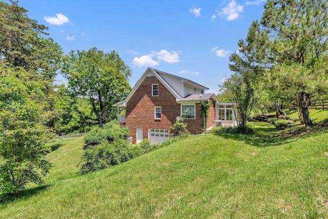 view of front of property with a garage and a front yard