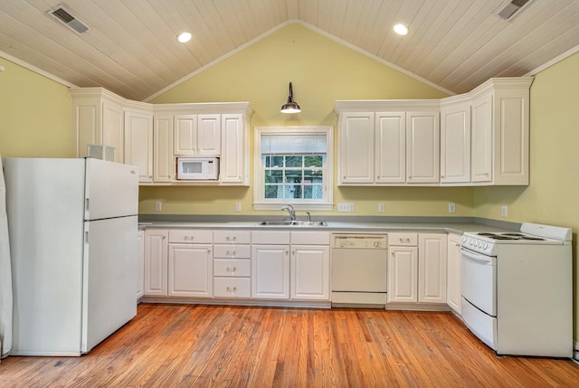 kitchen with vaulted ceiling, white cabinetry, sink, and white appliances